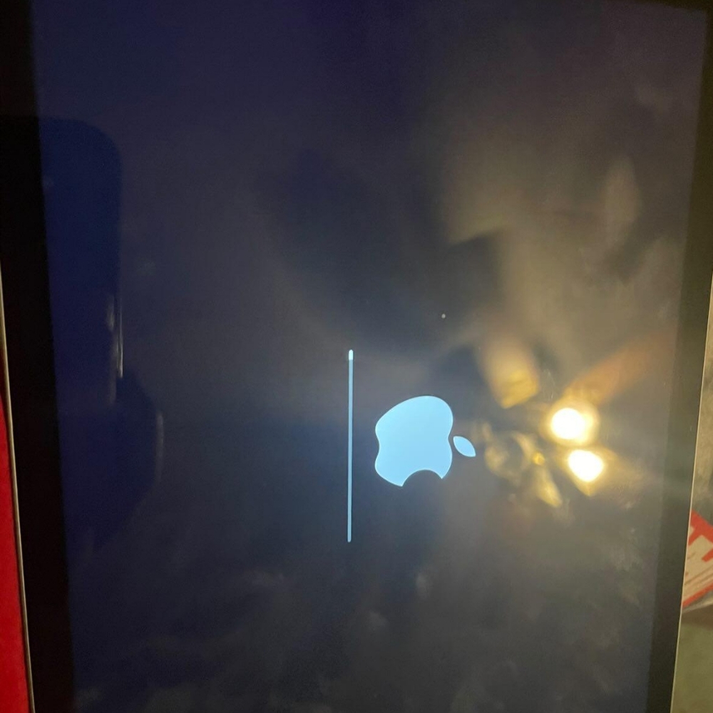 Apple Device with Black Display and Blue Logo